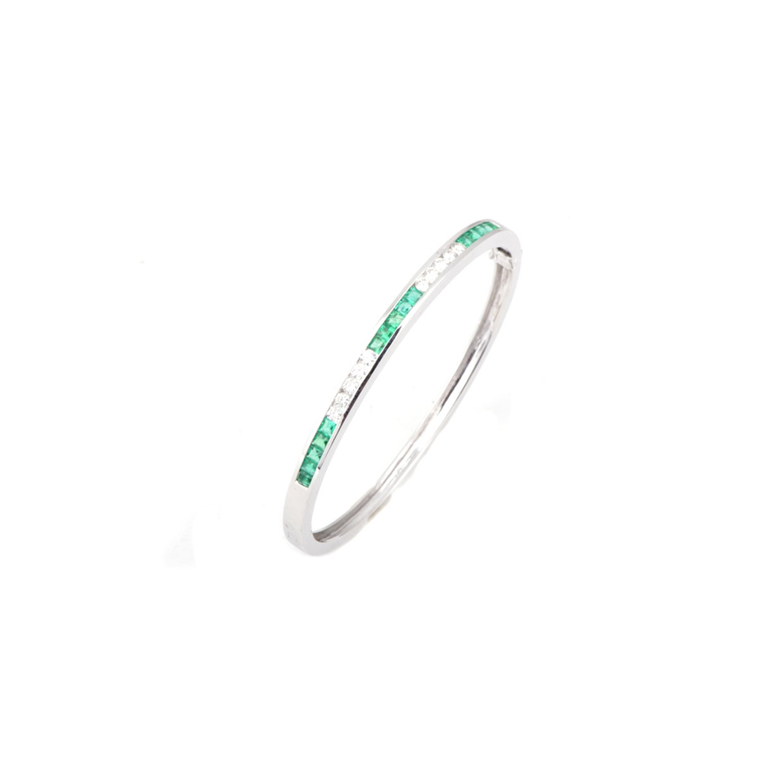 14K White Gold Emerald and Diamond Channel Set Bangle Bracelet, Emeralds weigh 1.21cttw, Diamonds weigh 0.64cttw.